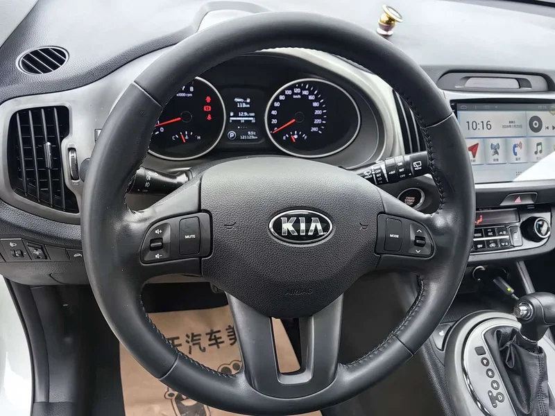 Kia Sportage — фото 6
