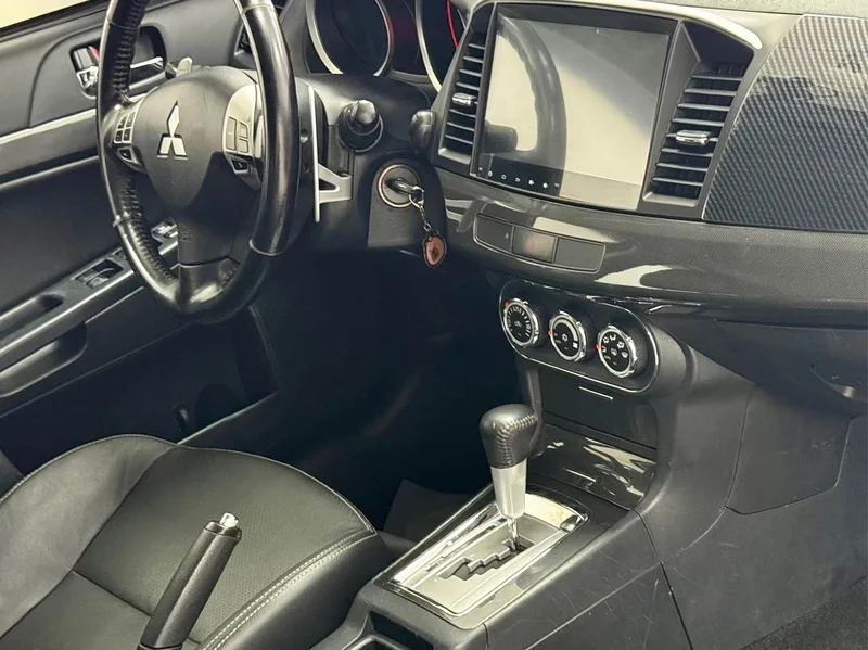Mitsubishi Lancer EX — фото 11