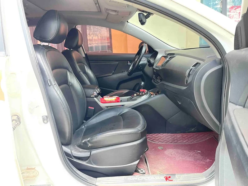 Kia Sportage — фото 12