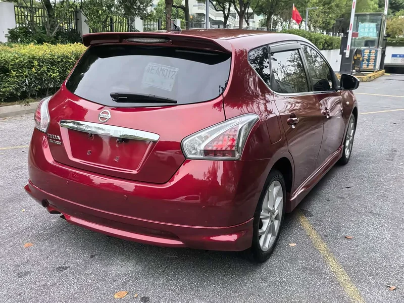 Nissan Tiida — фото 11