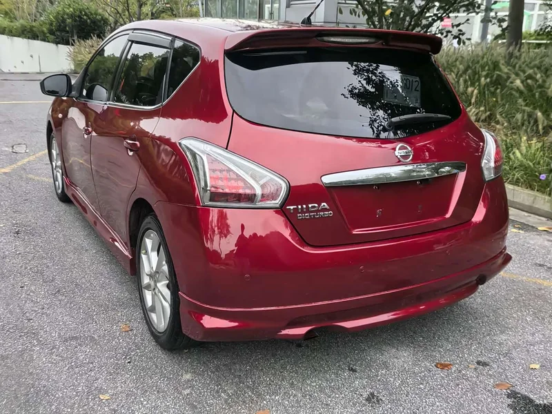Nissan Tiida — фото 9