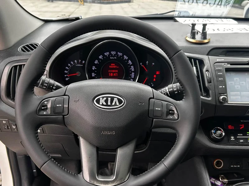 Kia Sportage — фото 12