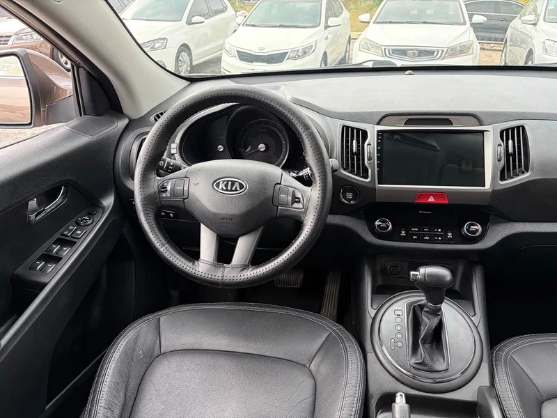 Kia Sportage — фото 11