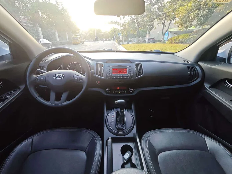 Kia Sportage — фото 13