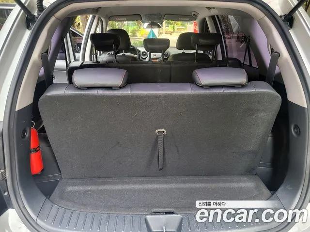 Kia Carens — фото 12