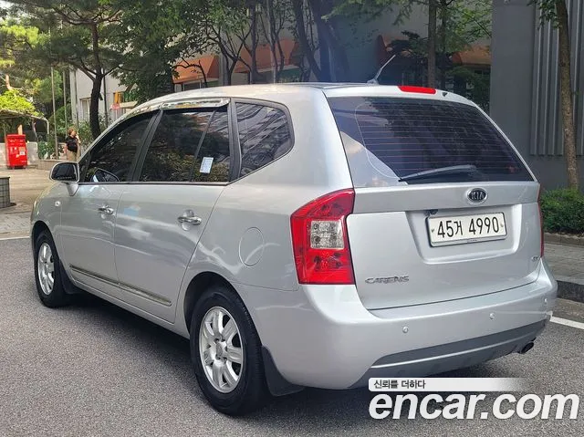 Kia Carens — фото 20