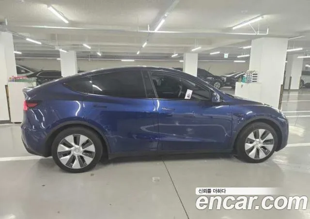 Tesla Model Y — фото 12