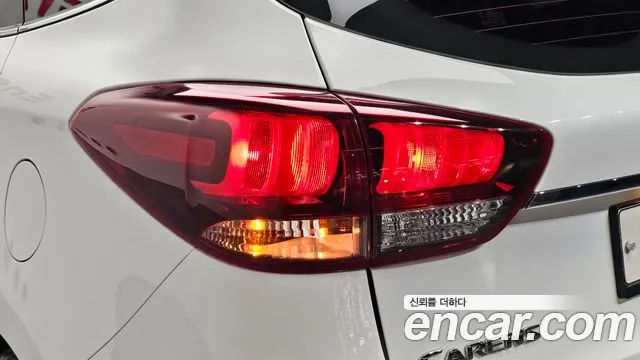 Kia Carens — фото 23